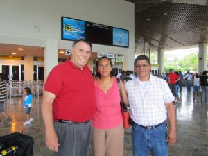 Bro. Doug being met at the airport by Bro. Manuel and Sis. Sylvia Fernandez